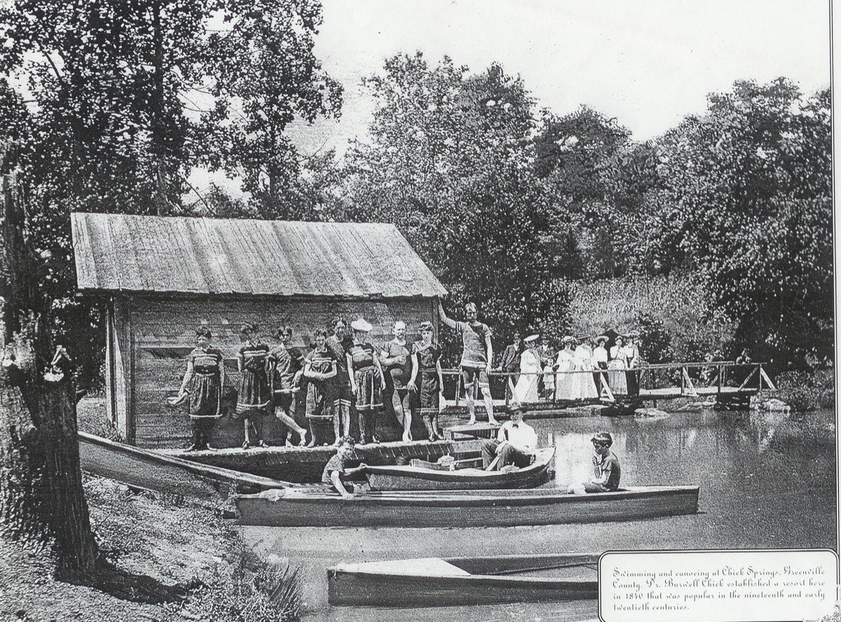 Swimming and canoeing at Chick Springs with bathhouse and boats, c. 1926–1929