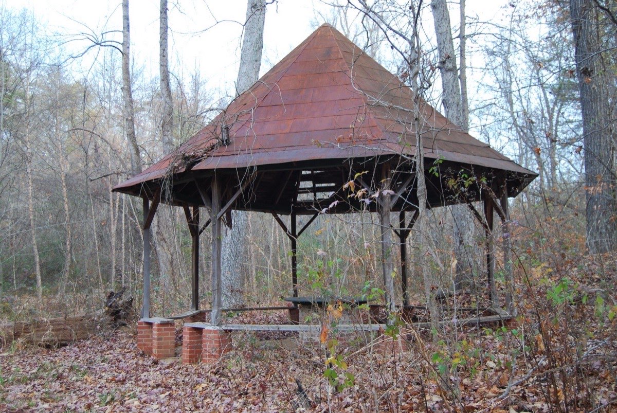 The weathered picnic gazebo in 2007, with rusty metal roof and deteriorating wooden supports