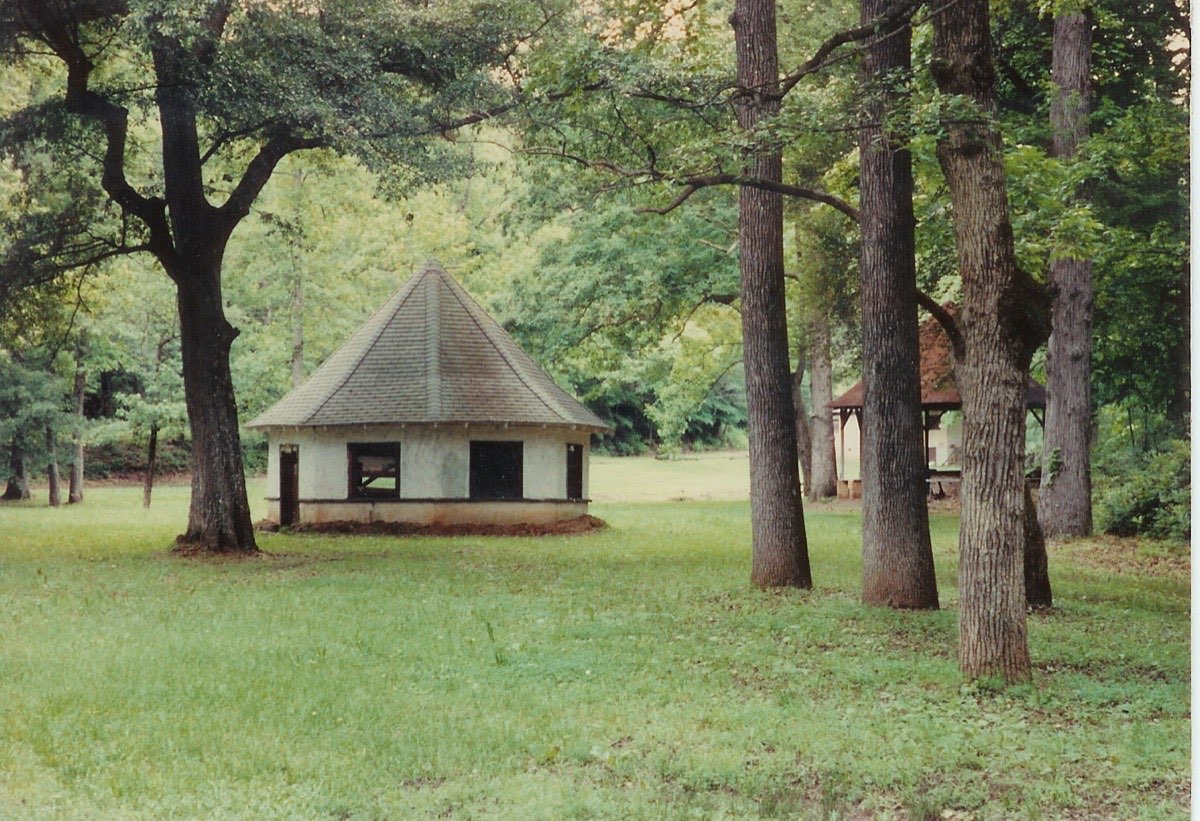 Color photograph of the Chick Springs springhouse and gazebo, c. 1975–1985